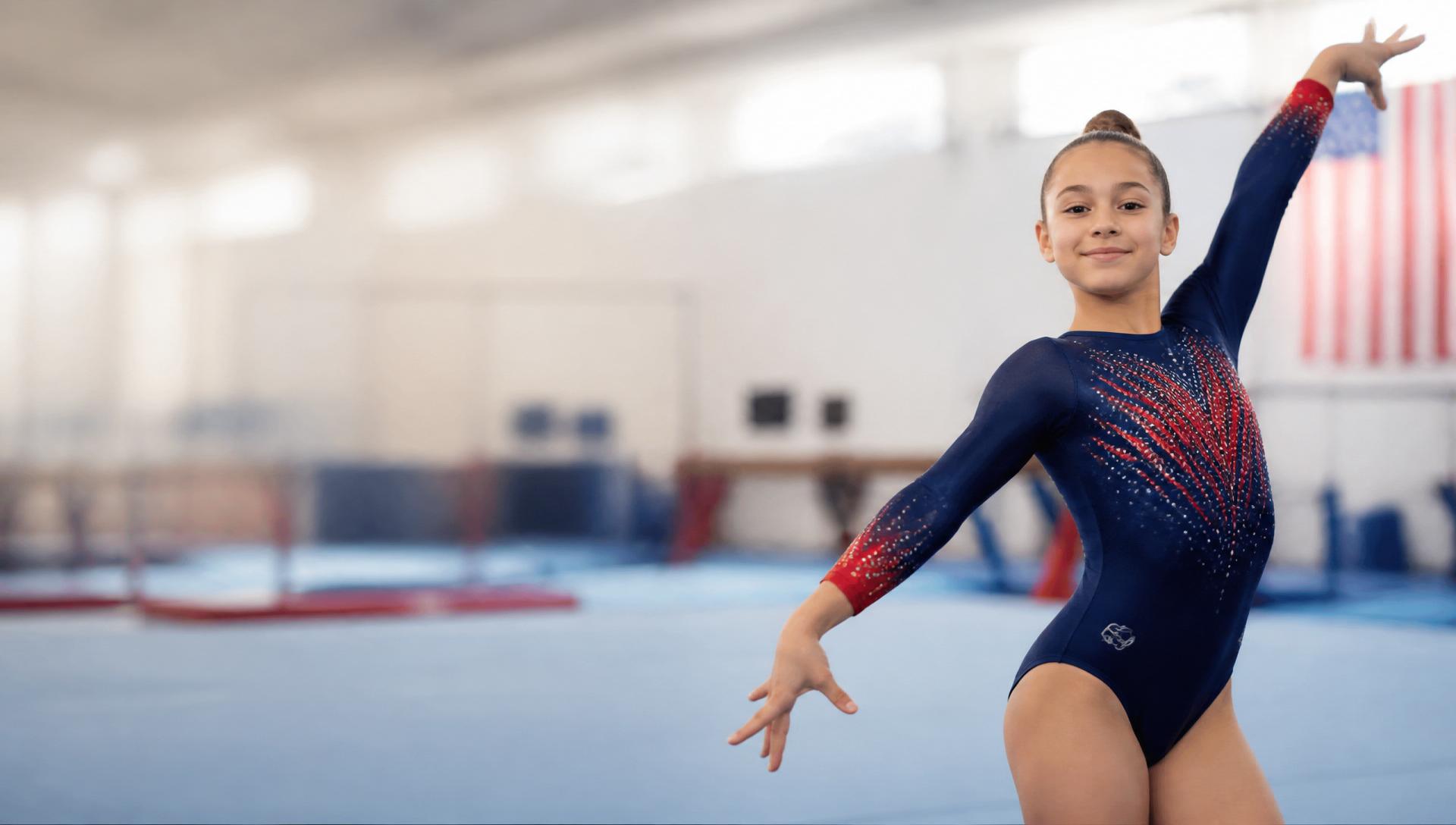 Youth gymnast in a navy and crimson leotard training in a bright gymnasium